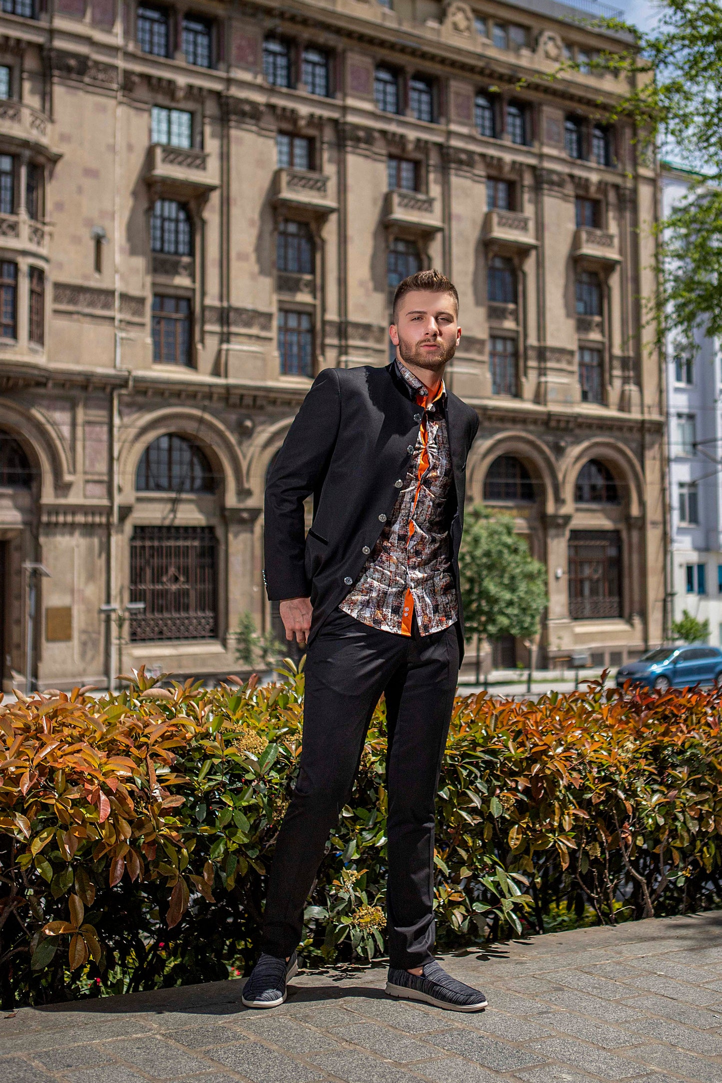 Bold banded black suit with combination of shirt