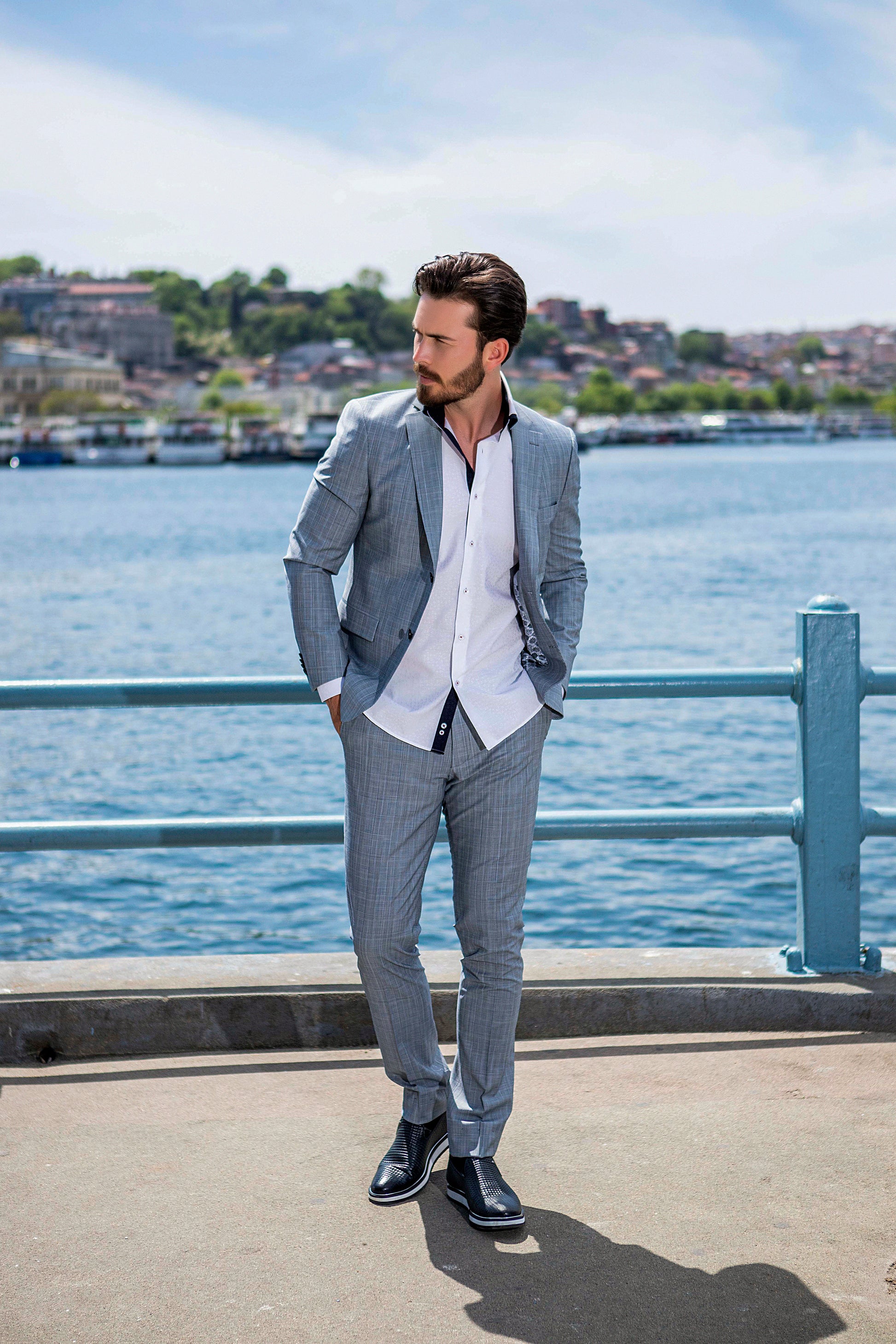Slim white dress shirt with embesselment detail and a dark blue interlining. Small Valenti Moda logo patch on right chest.